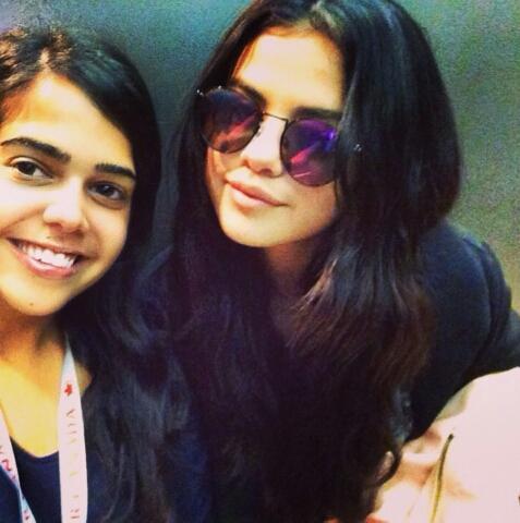 Selena with a fan at the airport in Waterloo, Canada
